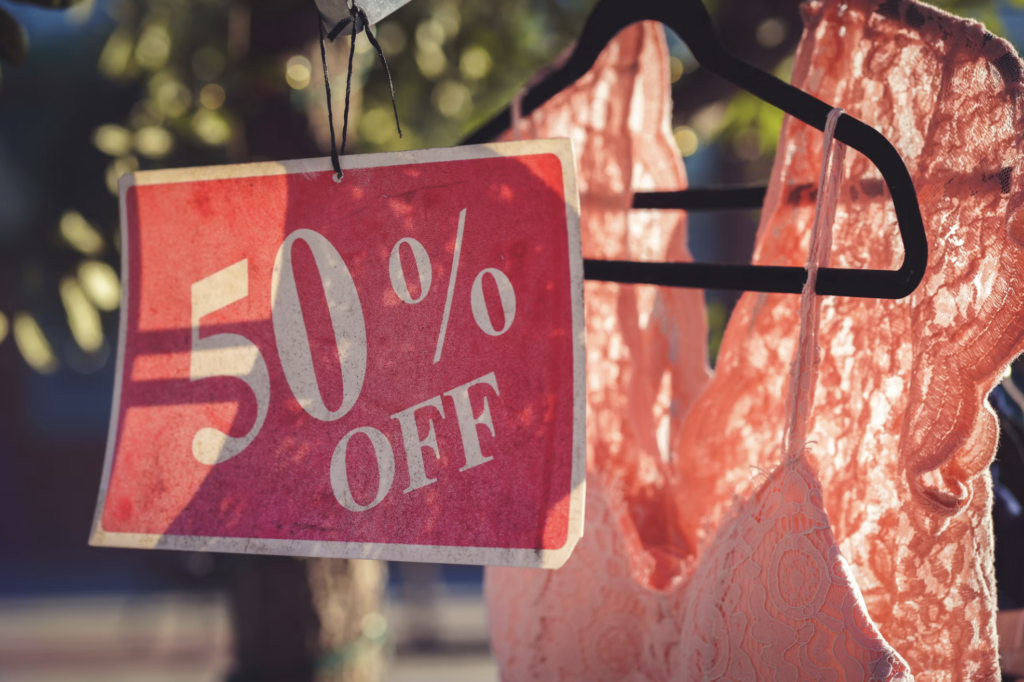 Image of clothing with a sales sign that could entice someone to buy