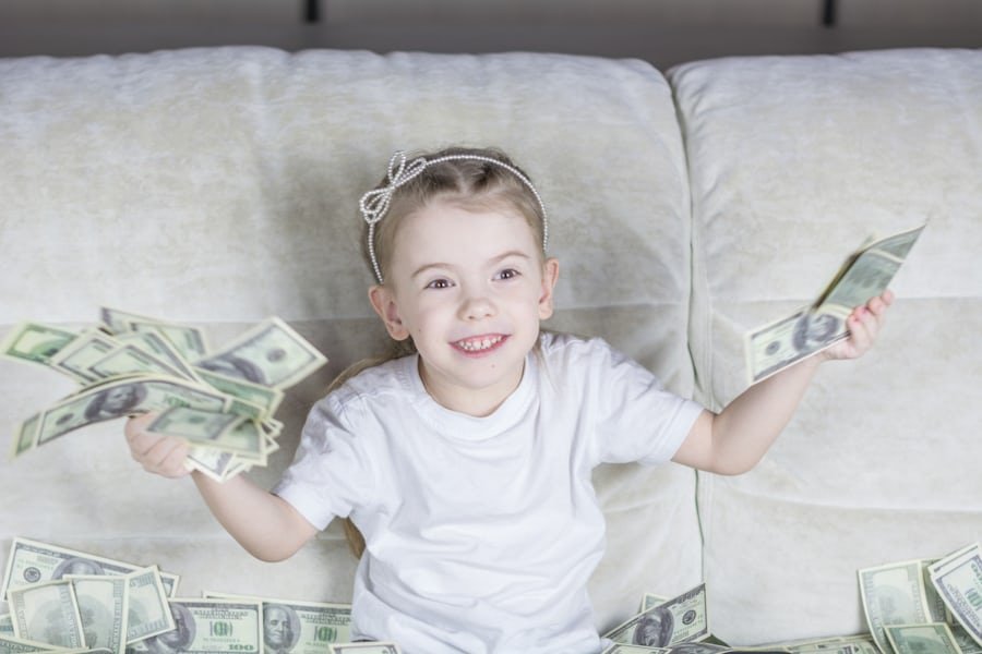 child holding bank notes